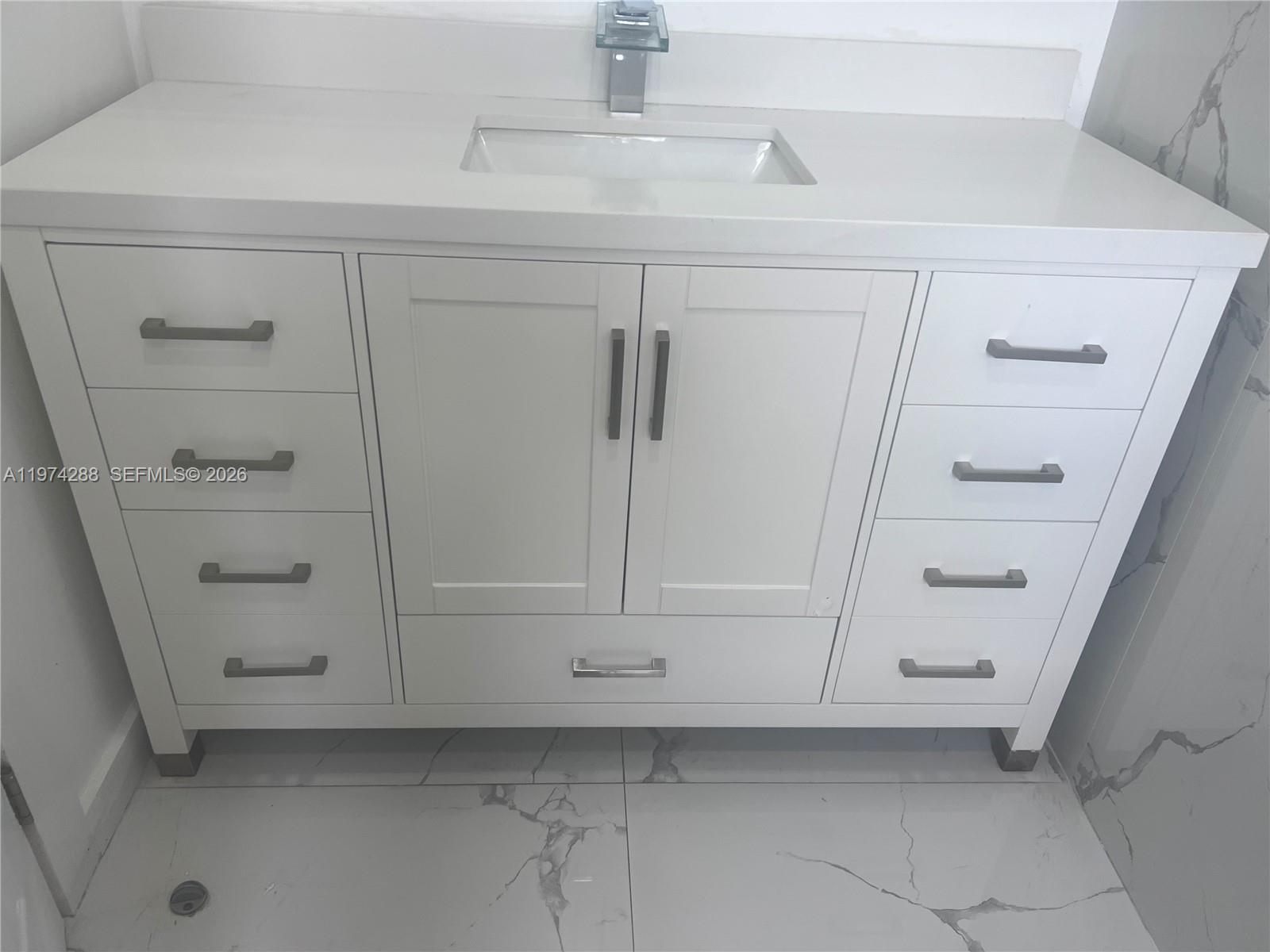 26120 Southwest 130th Avenue Homestead, FL 33032 - Photo 21 of 34 a view of an empty walk in closet