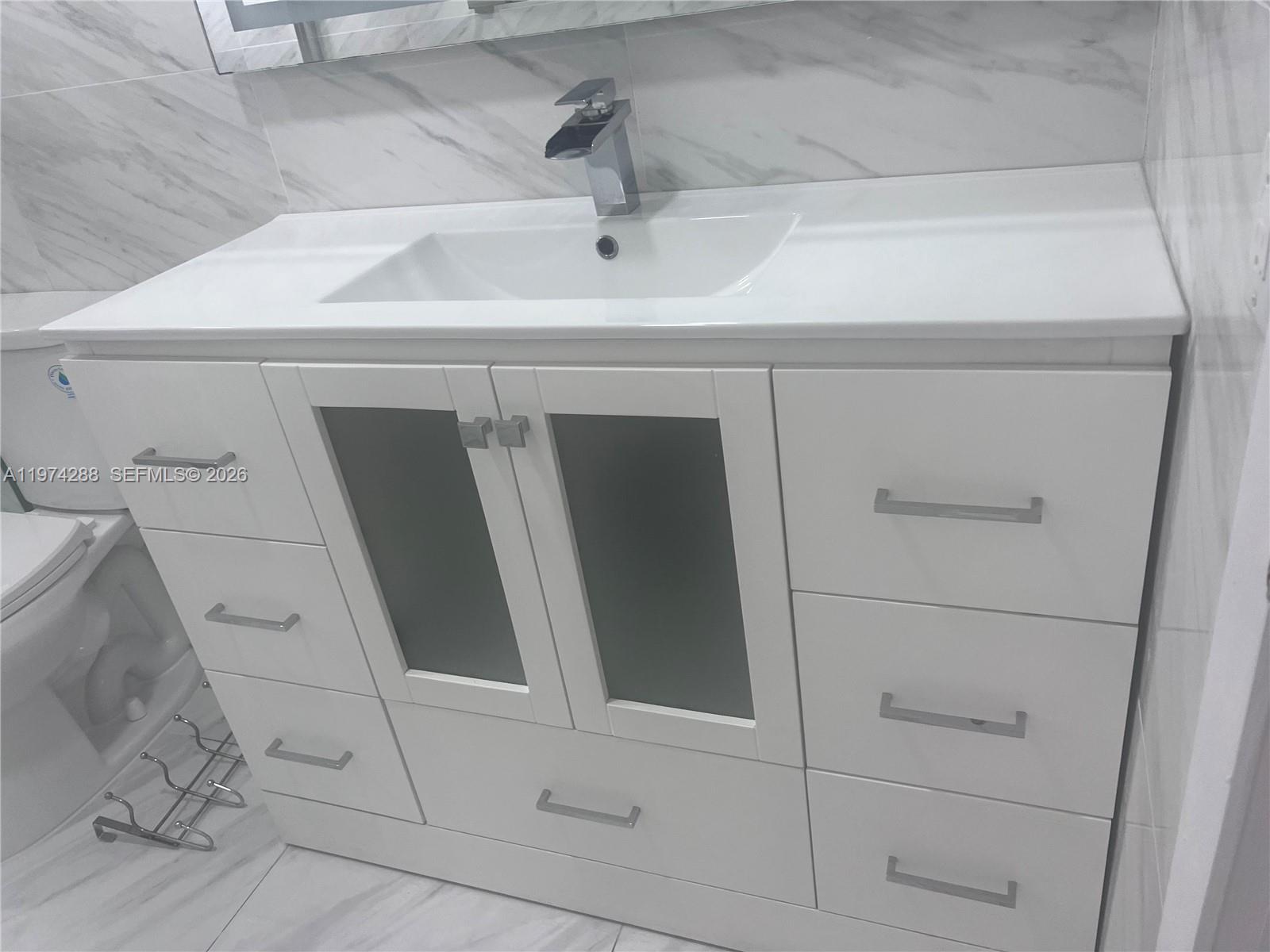 26120 Southwest 130th Avenue Homestead, FL 33032 - Photo 25 of 34 a close view of cabinet