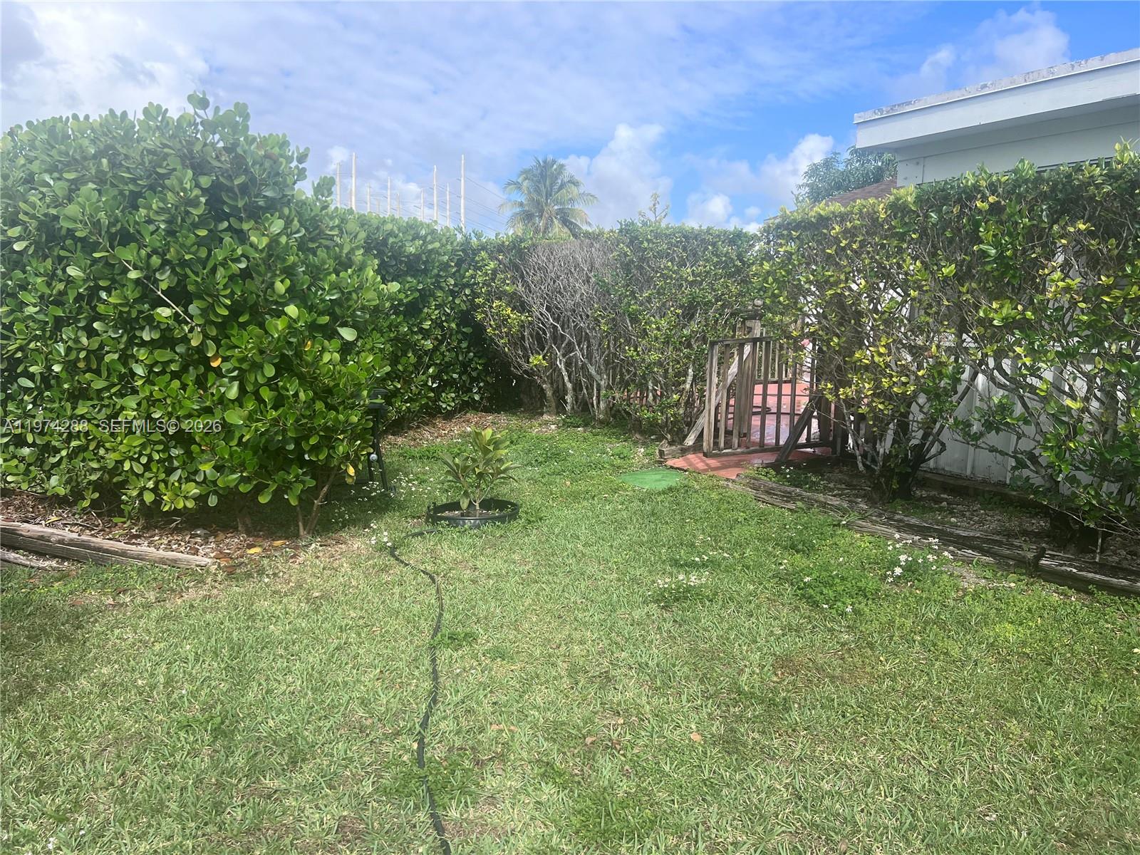 26120 Southwest 130th Avenue Homestead, FL 33032 - Photo 3 of 34 a view of outdoor space with deck and yard