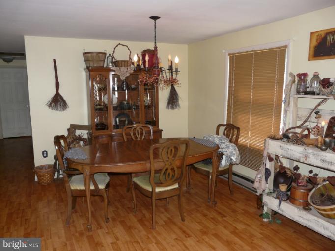 6158 Telegraph Road Elkton, MD 21921 - Photo 4 of 12 a view of a dining room with furniture and wooden floor