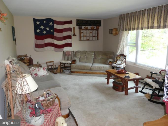 6158 Telegraph Road Elkton, MD 21921 - Photo 7 of 12 a living room with furniture and a large window