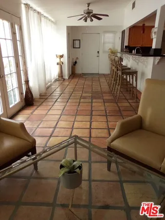 a room with furniture and flat screen tv