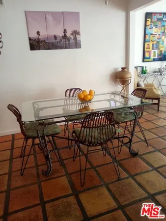 a view of a dining room with furniture and window