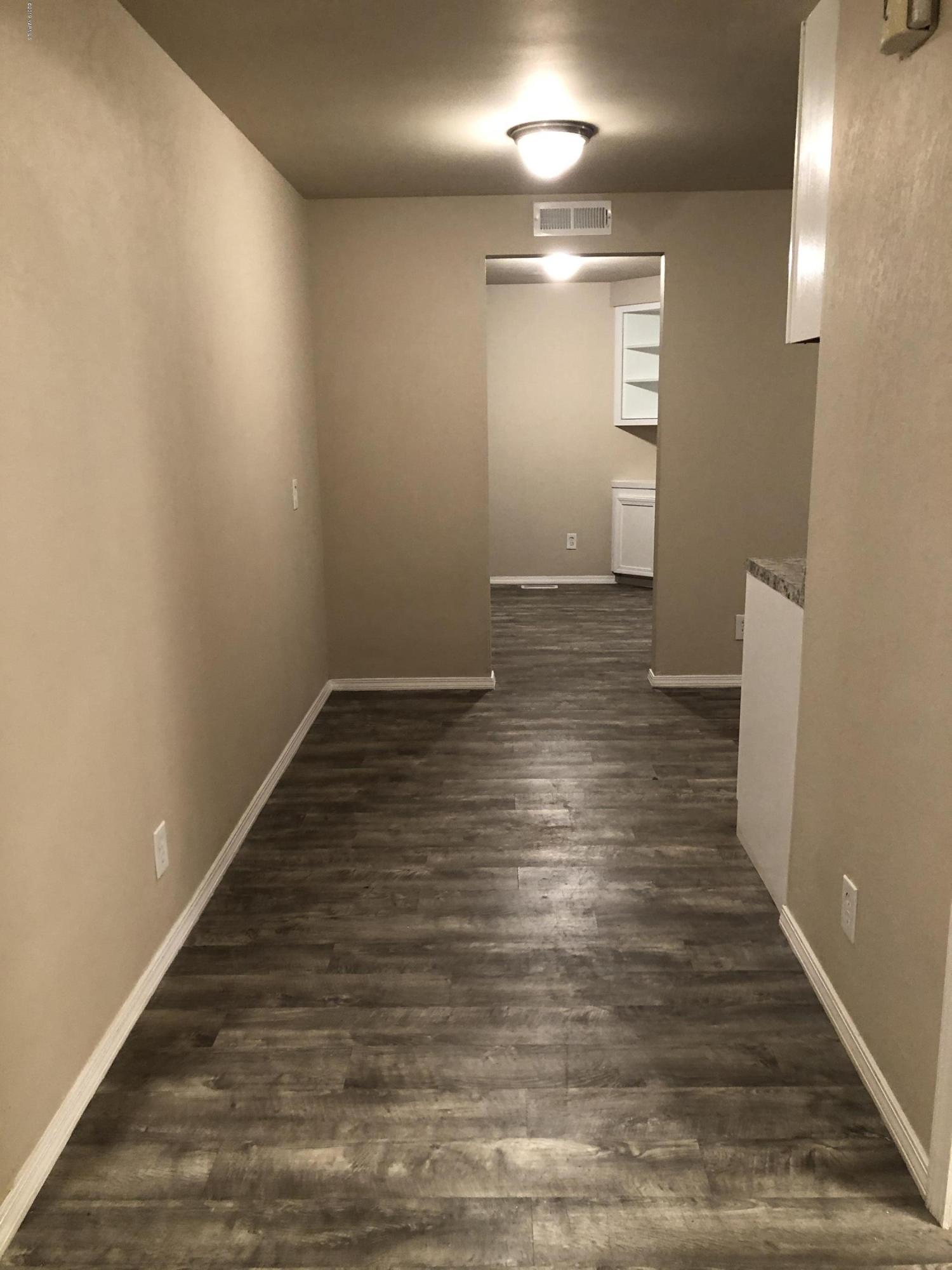 4930 Lateral A Road Wapato, WA 98951 - Photo 14 of 19 a view of a hallway with wooden floor