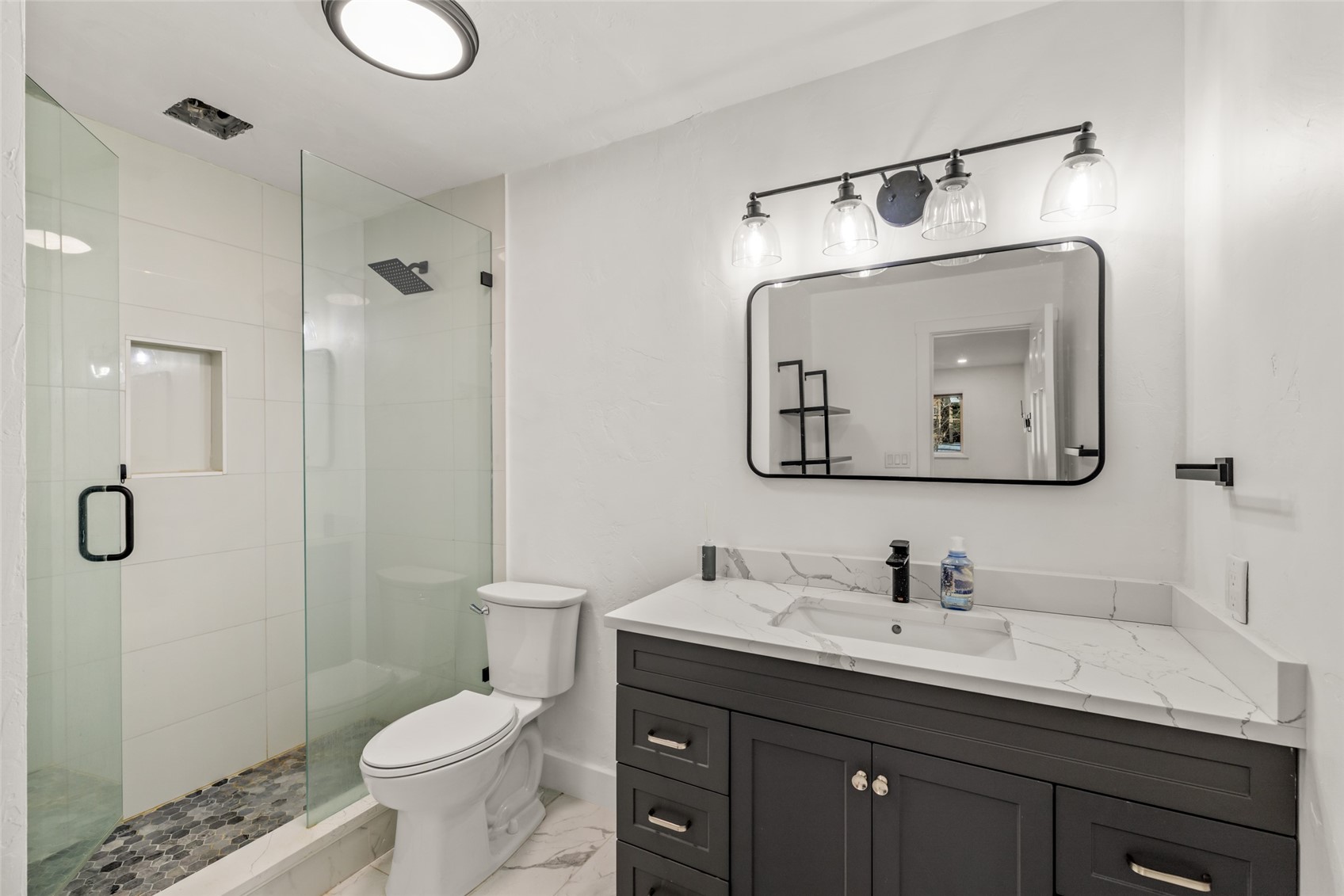 1375 Walton Creek Road, Unit 7 Steamboat Springs, CO 80487 - Photo 13 of 21 a bathroom with a toilet sink double vanity and mirror