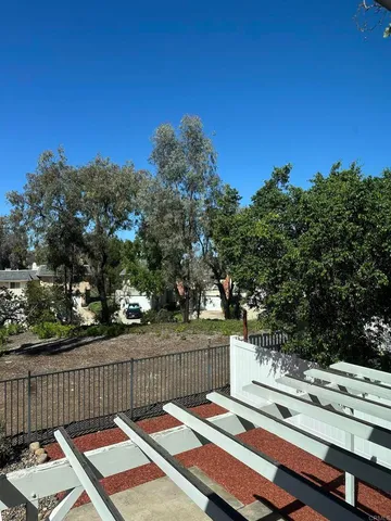 a view of a two chairs on the roof deck