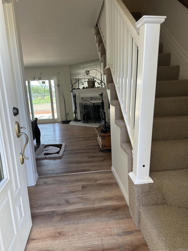 12939 Cree Court Poway, CA 92064 - Photo 5 of 15 a view of entryway and hall with wooden floor