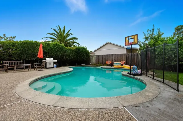 a view of a house with swimming pool