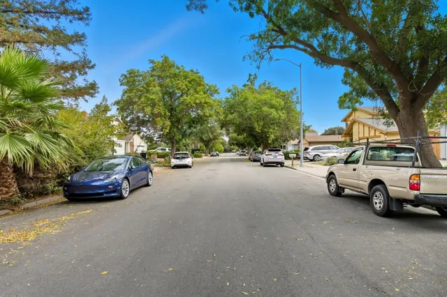 a view of street with parked cars