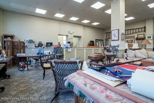 a living room with furniture and windows