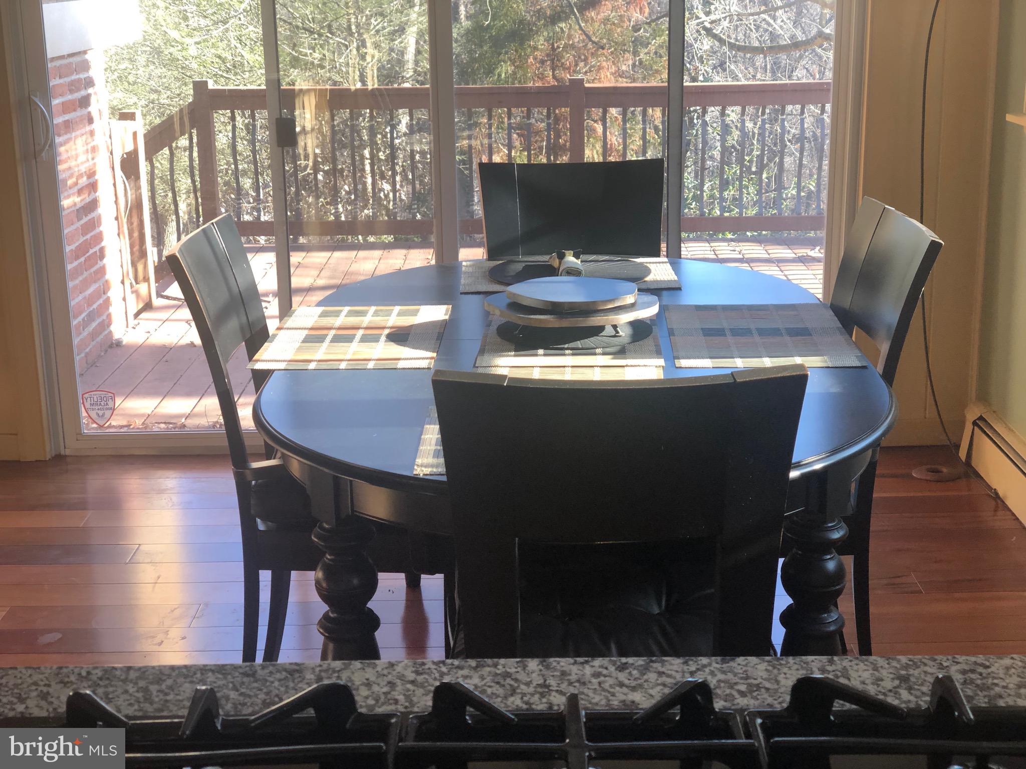 351 Hidden River Road Penn Valley, PA 19072 - Photo 6 of 48 a view of a dining room with furniture and wooden floor