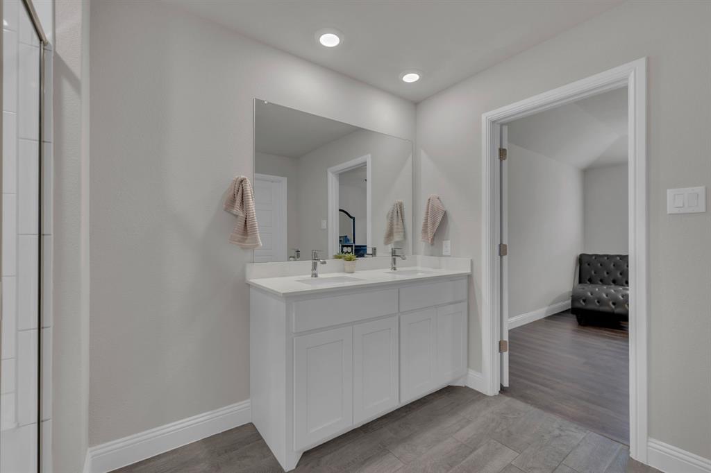 728 Golden Gate Pk Road Alvarado, TX 76009 - Photo 13 of 23 Bathroom featuring light wood-style floors, double vanity, and recessed lighting