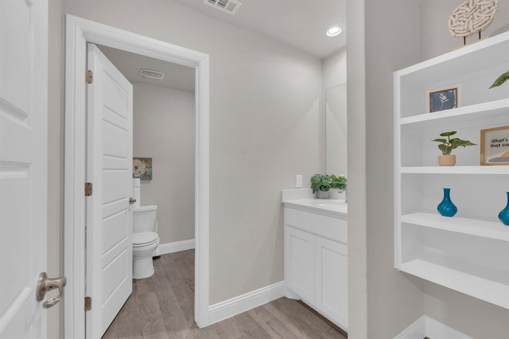 728 Golden Gate Pk Road Alvarado, TX 76009 - Photo 20 of 23 Bathroom with vanity and light wood finished floors