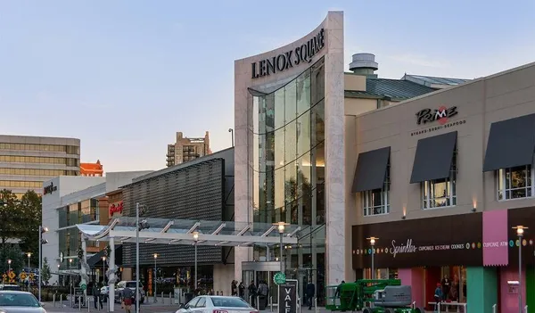 a front view of a building with retail shop and retail shops
