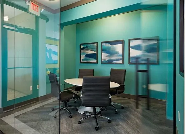 a workspace with furniture and a window
