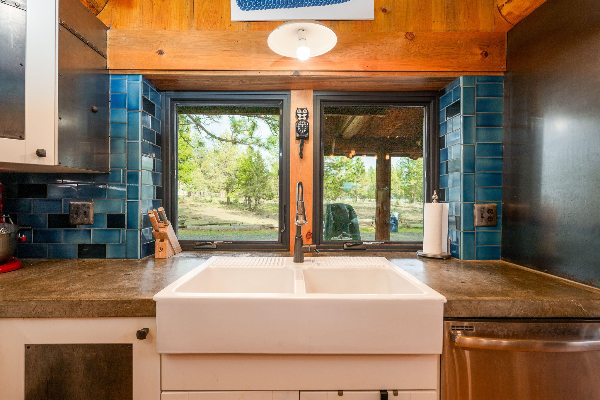 16011 Old Juniper Road Sisters, OR 97759 - Photo 11 of 41 a kitchen with kitchen island a large window in it