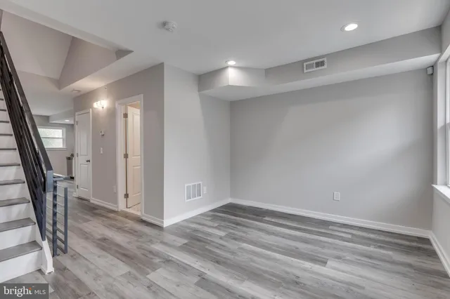 a view of entryway with wooden floor