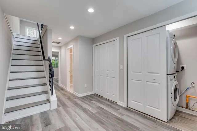 a view of entryway with stairs and wooden floor