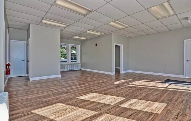 a view of a livingroom with wooden floor