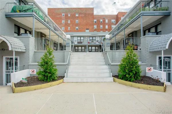 a front view of a building with garden