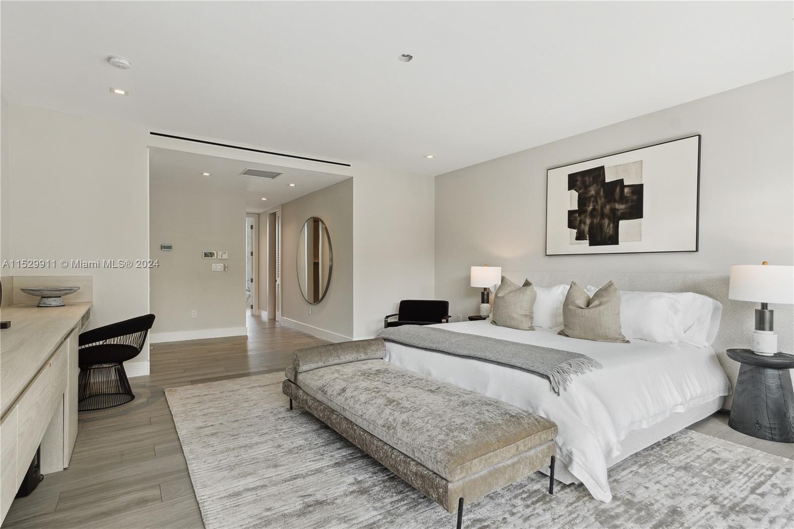 4060 Woodridge Road Miami, FL 33133 - Photo 13 of 49 a spacious bedroom with a bed and a couch