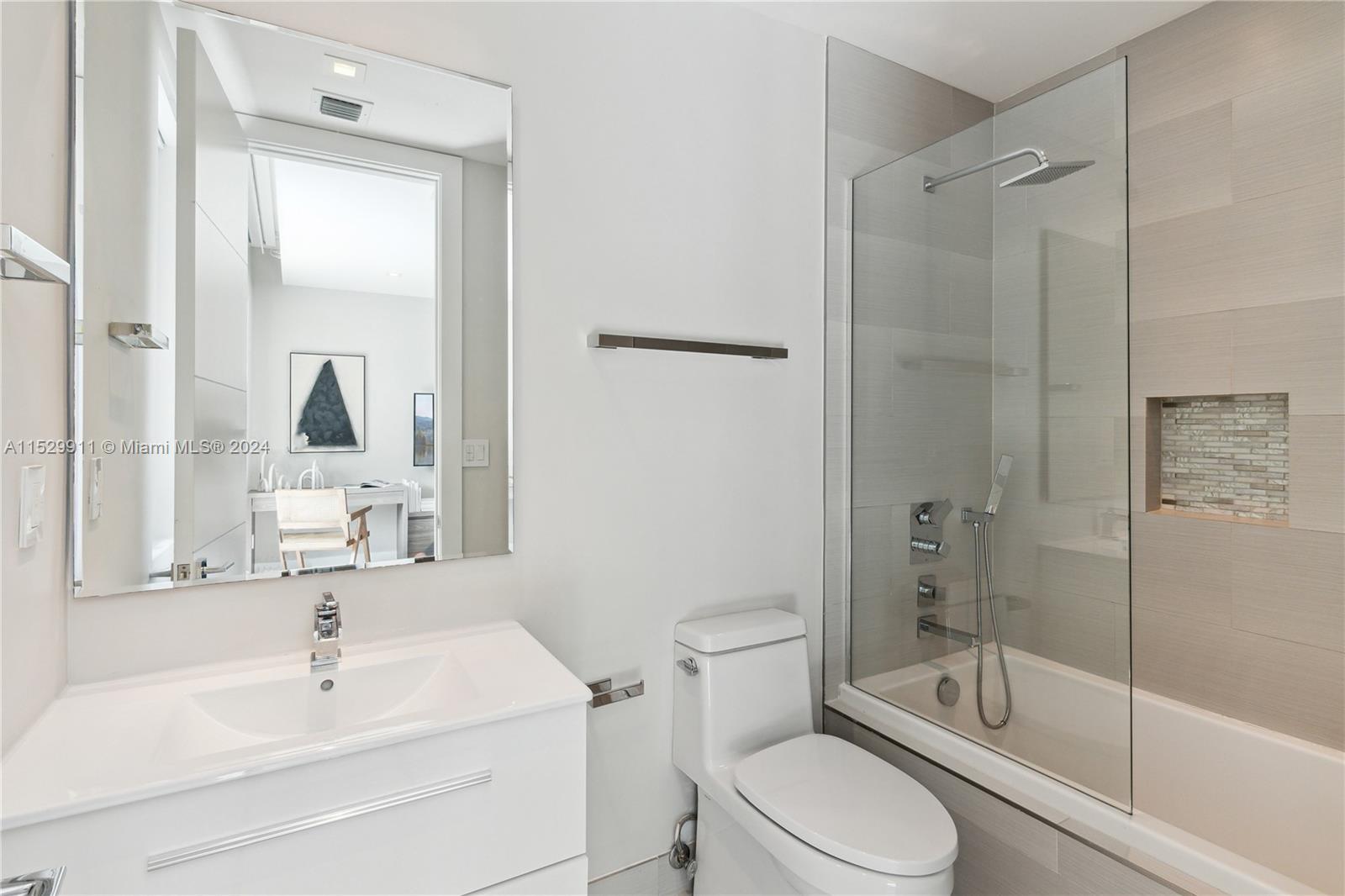 4060 Woodridge Road Miami, FL 33133 - Photo 21 of 49 a bathroom with a sink toilet and shower