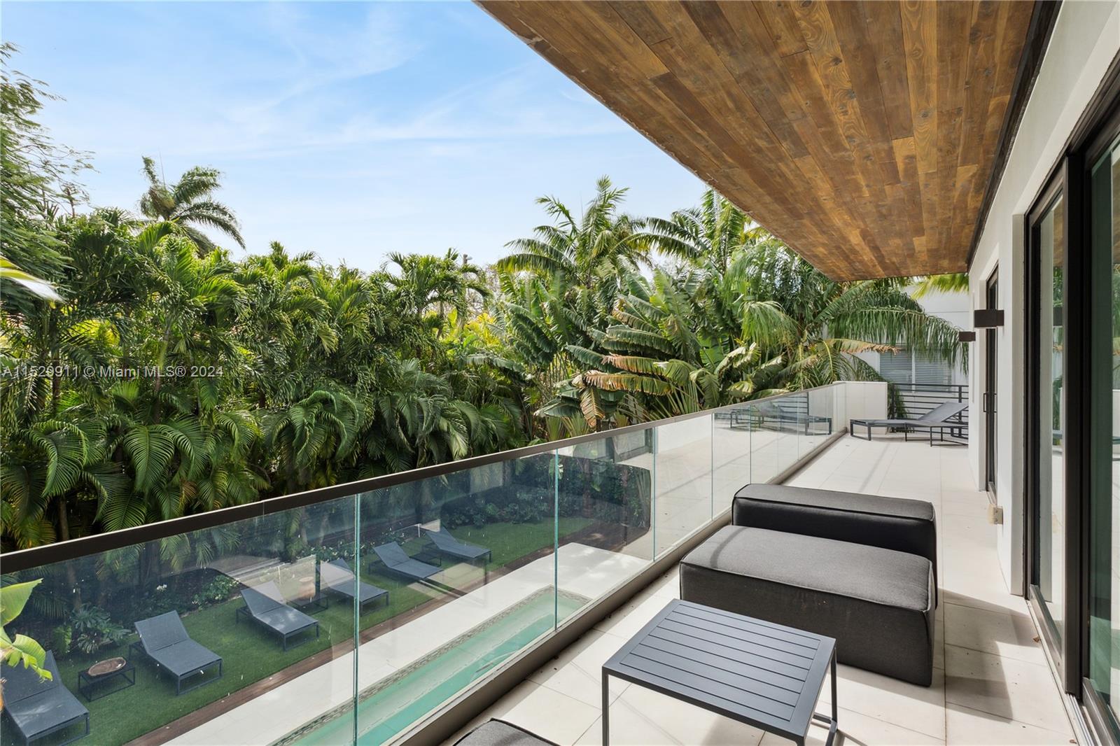 4060 Woodridge Road Miami, FL 33133 - Photo 26 of 49 a view of a balcony with chairs