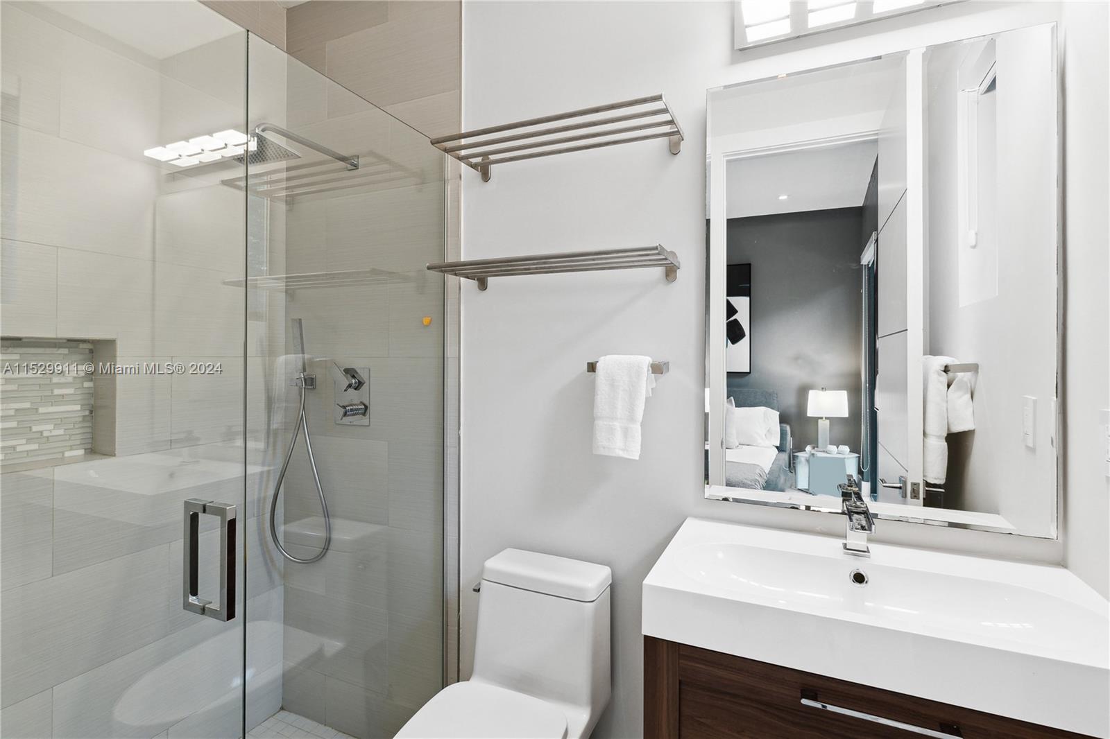 4060 Woodridge Road Miami, FL 33133 - Photo 30 of 49 a bathroom with a sink toilet and shower