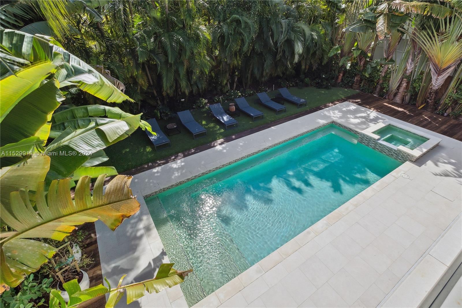 4060 Woodridge Road Miami, FL 33133 - Photo 32 of 49 a view of a yard with plants