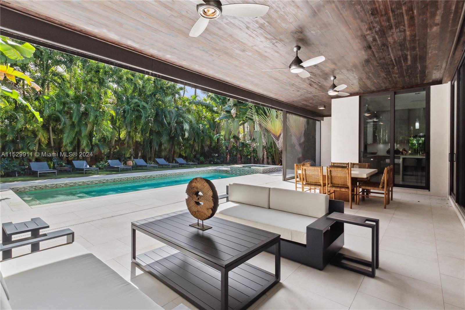 4060 Woodridge Road Miami, FL 33133 - Photo 33 of 49 a outdoor space with patio the couches and a dining table with garden view