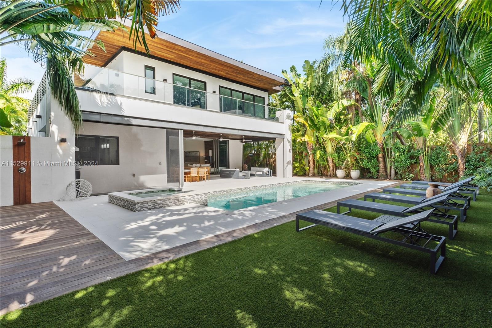4060 Woodridge Road Miami, FL 33133 - Photo 35 of 49 a view of a house with pool and sitting area