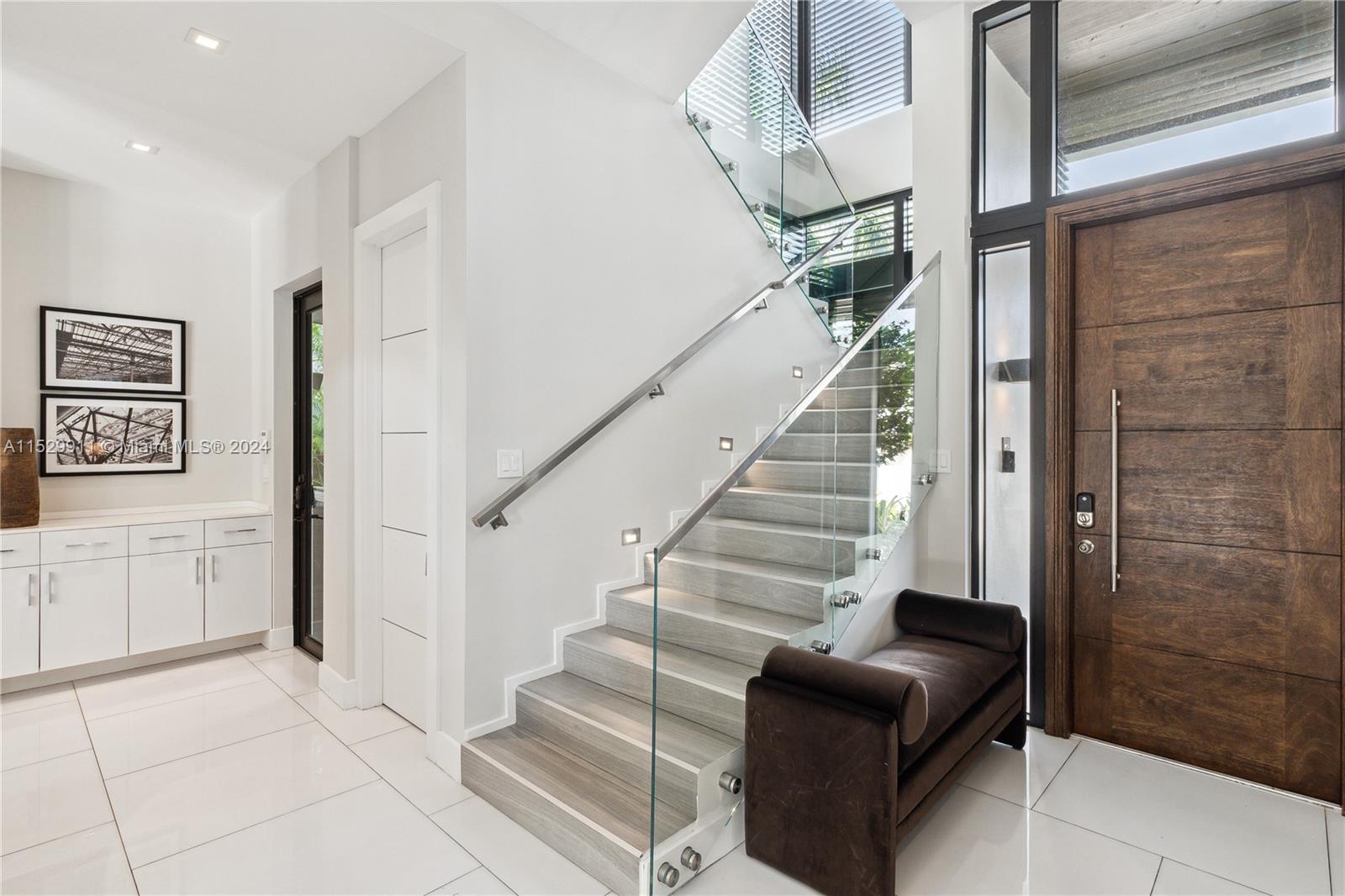 4060 Woodridge Road Miami, FL 33133 - Photo 38 of 49 a view of entryway and hall with a couch