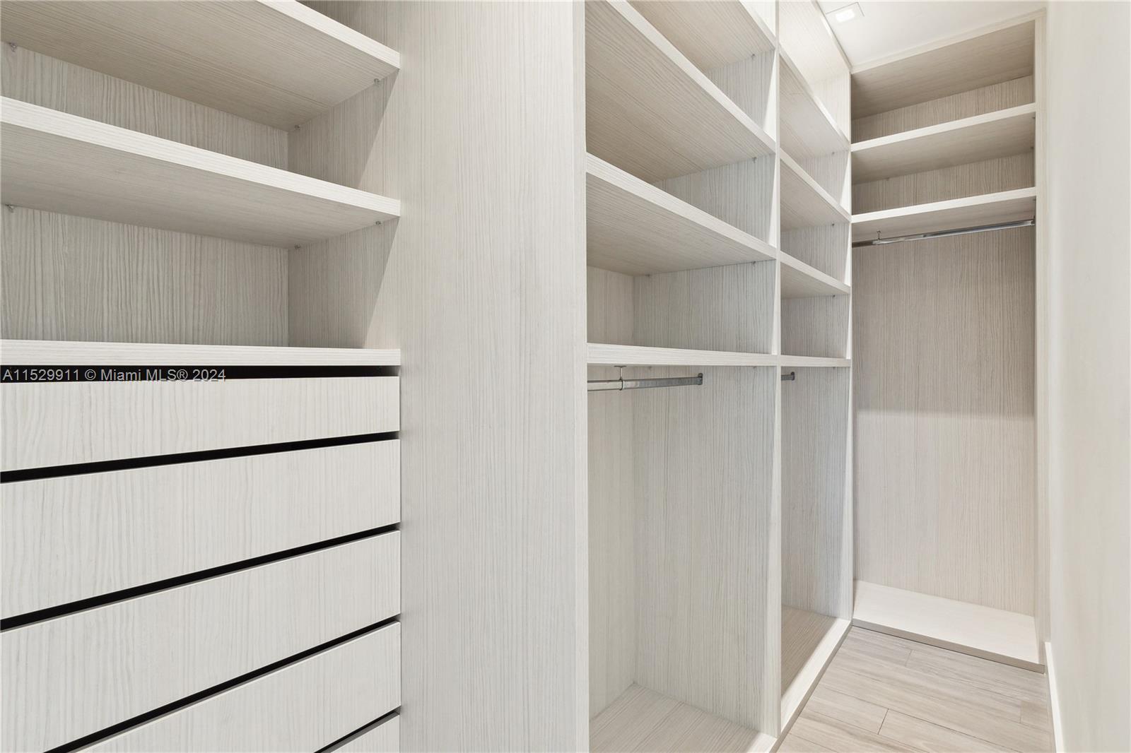 4060 Woodridge Road Miami, FL 33133 - Photo 40 of 49 a view of walk in closet with empty racks