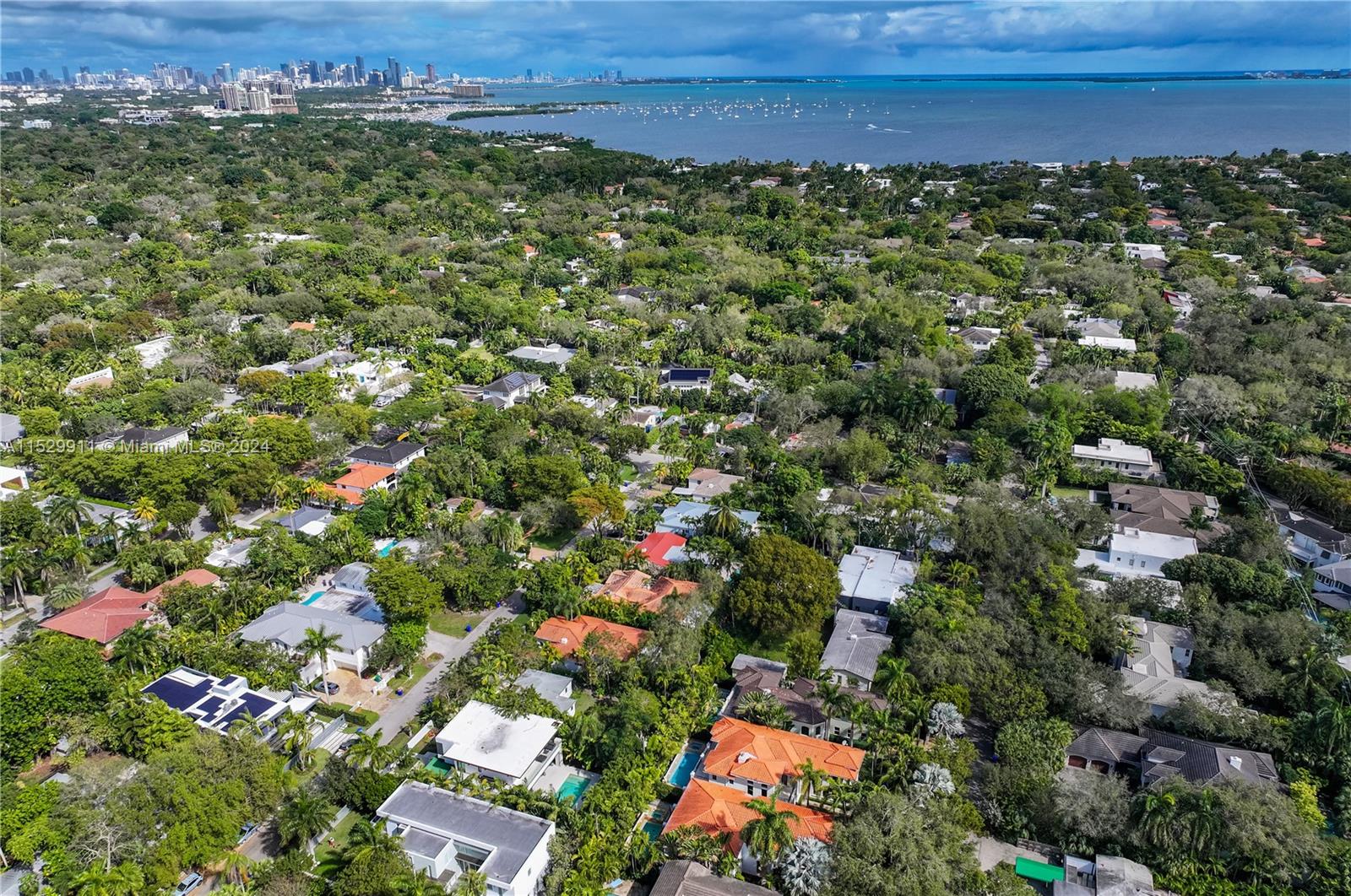 4060 Woodridge Road Miami, FL 33133 - Photo 43 of 49 an aerial view of residential houses with outdoor space and trees