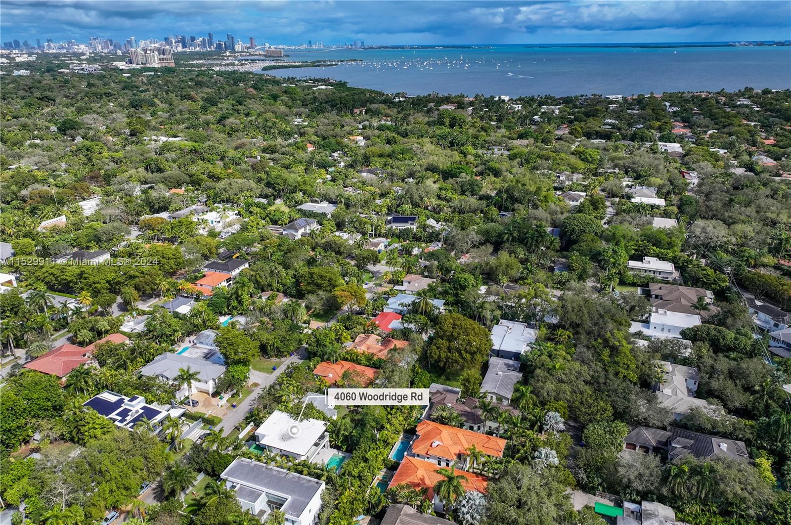 4060 Woodridge Road Miami, FL 33133 - Photo 44 of 49 an aerial view of a houses with a yard