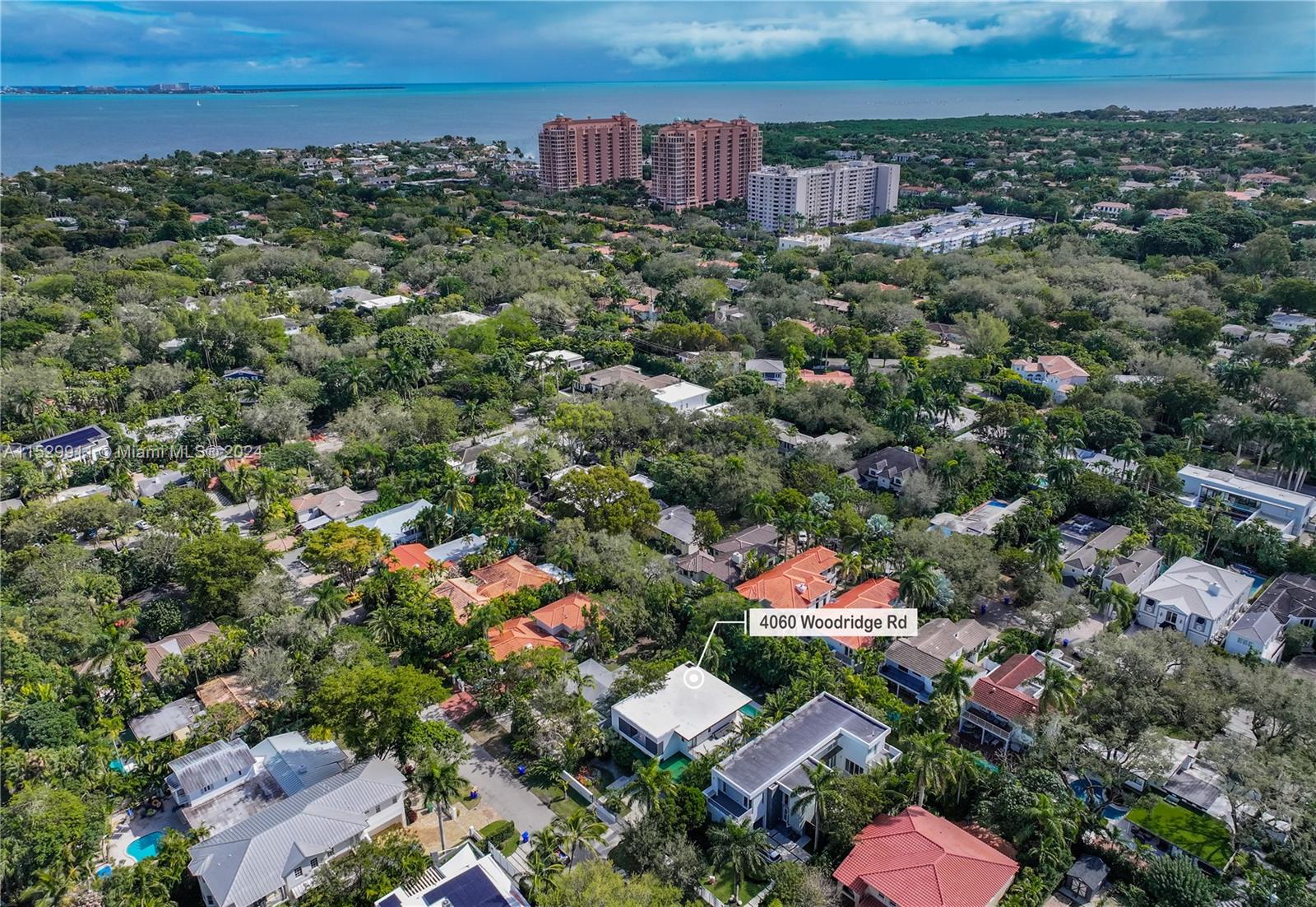 4060 Woodridge Road Miami, FL 33133 - Photo 46 of 49 an aerial view of residential houses with outdoor space and trees