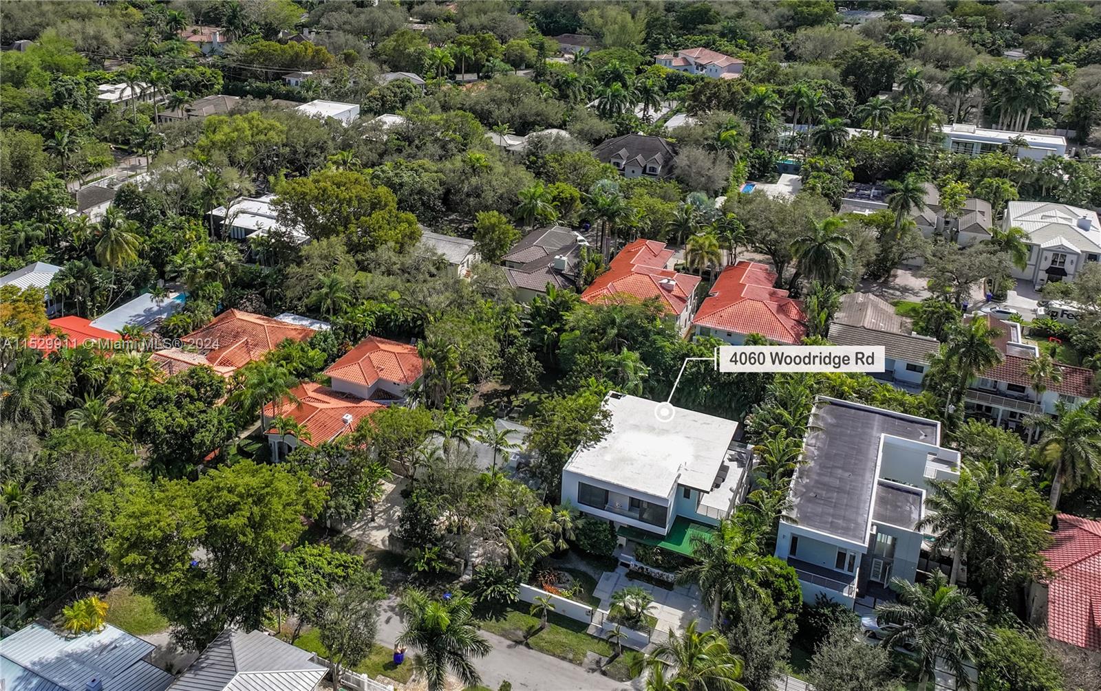 4060 Woodridge Road Miami, FL 33133 - Photo 48 of 49 an aerial view of residential house with outdoor space and swimming pool