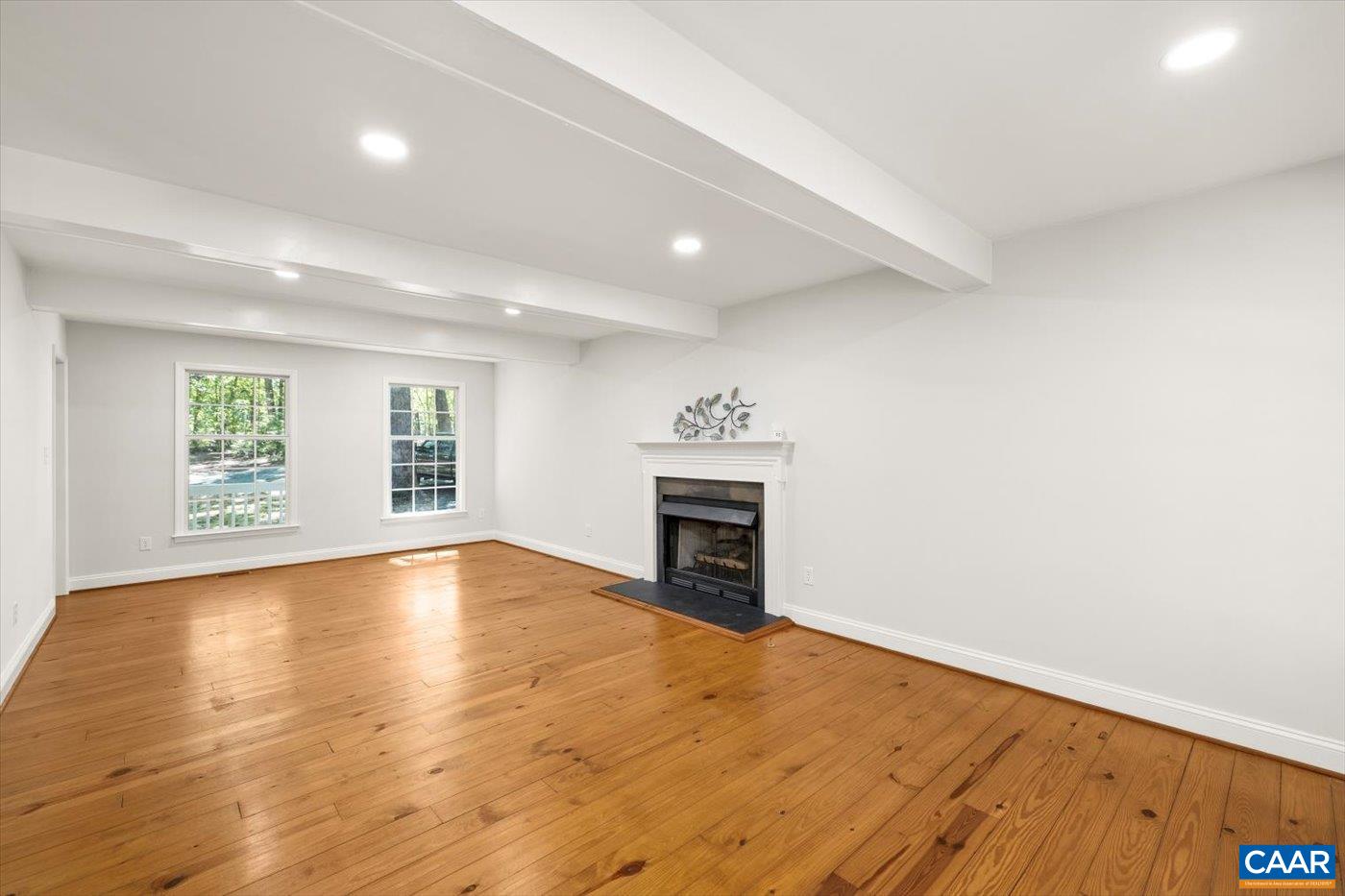 15379 Louisa Road Louisa, VA 23093 - Photo 11 of 45 an empty room with windows and fireplace