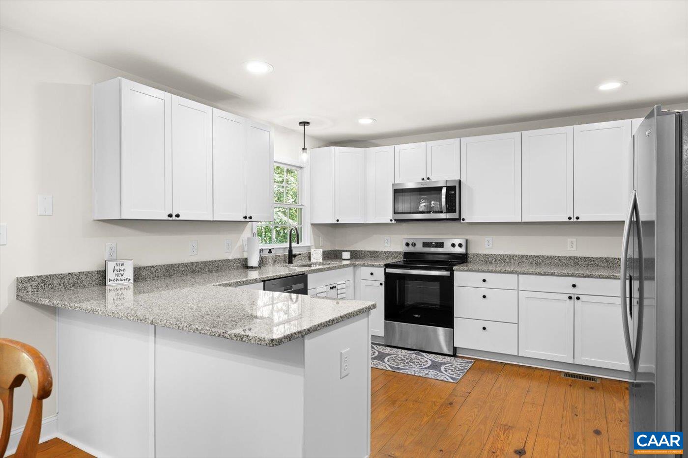 15379 Louisa Road Louisa, VA 23093 - Photo 18 of 45 a kitchen with stainless steel appliances granite countertop a sink stove and microwave