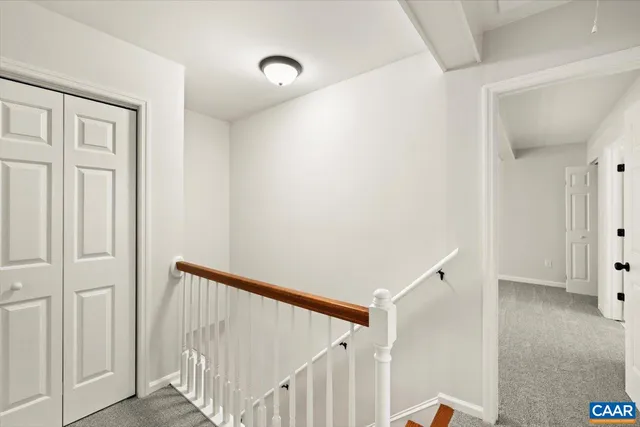 a view of a hallway with a white walls