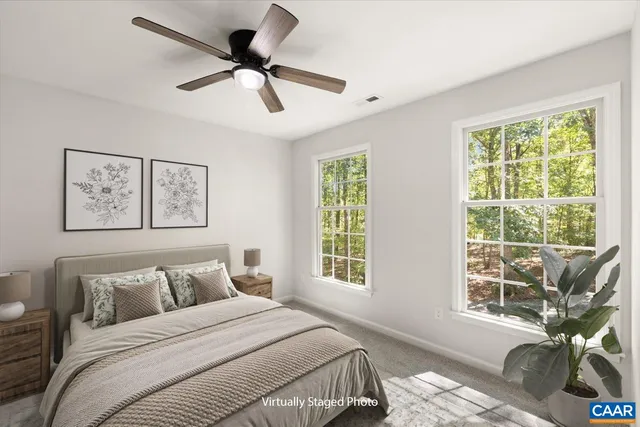 a bedroom with bed and a window