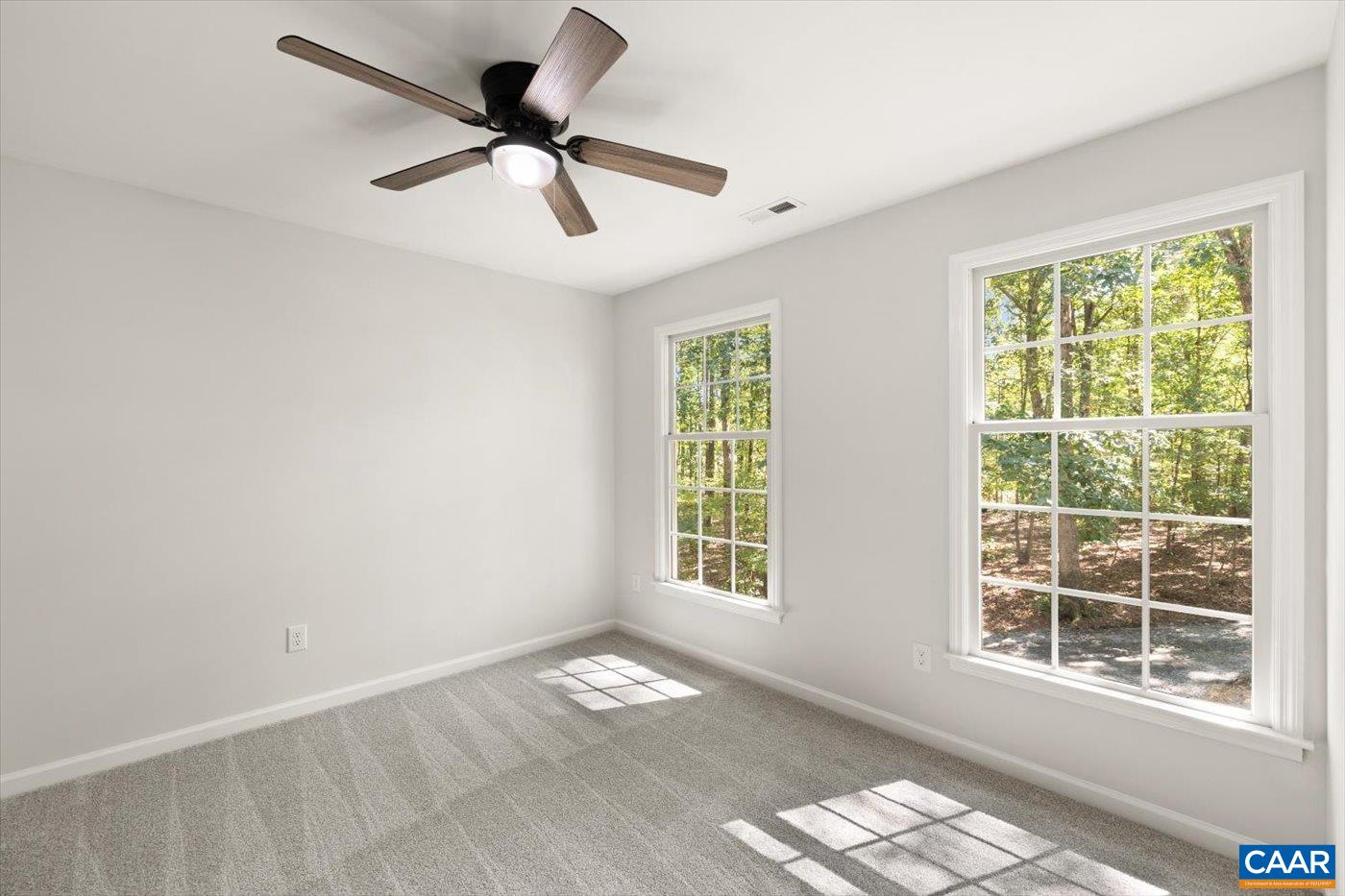 15379 Louisa Road Louisa, VA 23093 - Photo 21 of 45 a view of empty room with wooden floor and fan