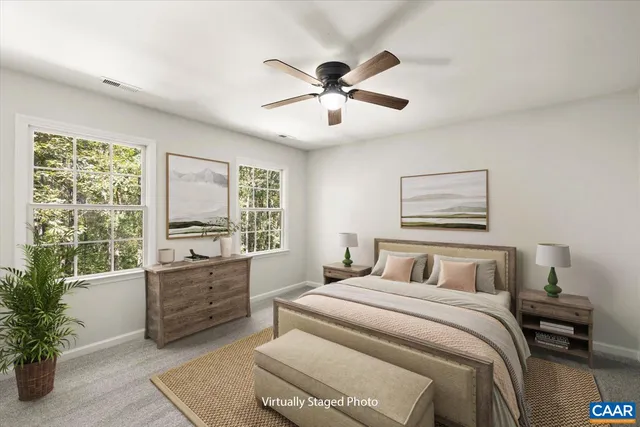 a bedroom with a large bed and a window