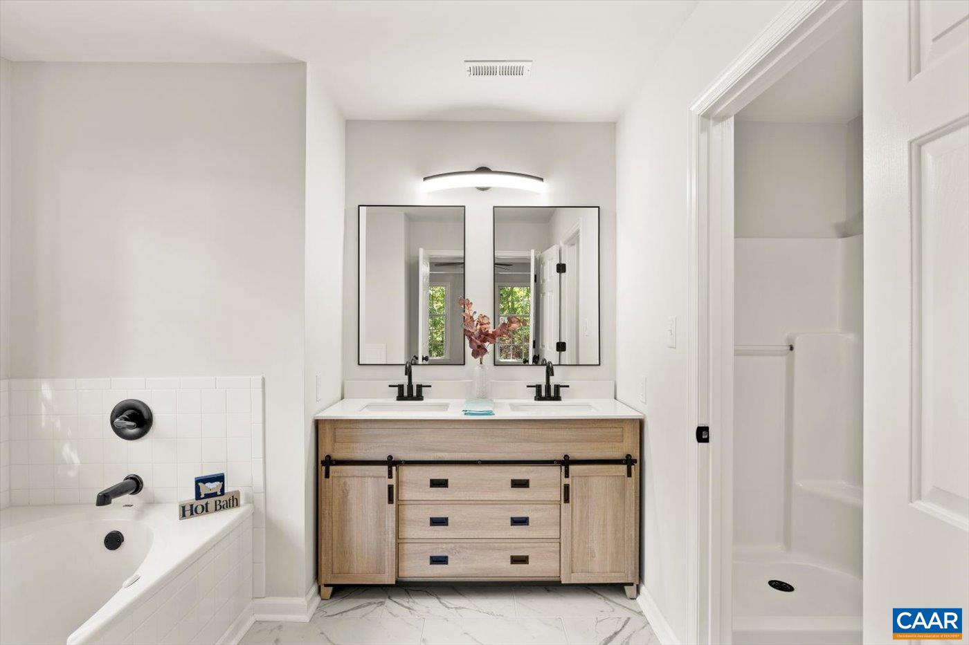 15379 Louisa Road Louisa, VA 23093 - Photo 31 of 45 a bathroom with a sink bath tub and shower