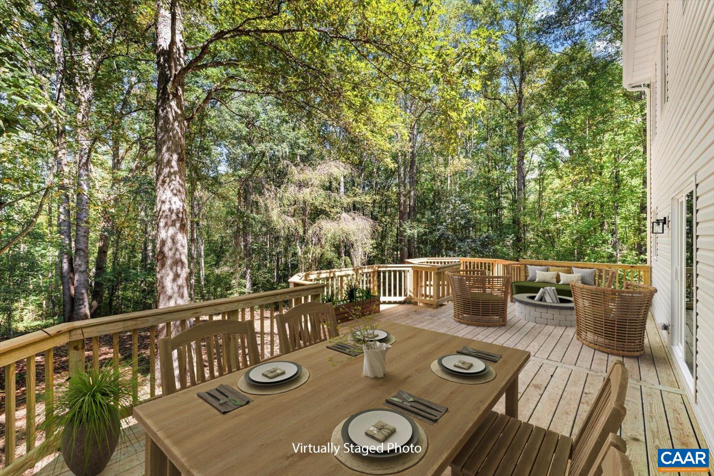 15379 Louisa Road Louisa, VA 23093 - Photo 38 of 45 a view of deck that has couches and table with wooden floor and fence