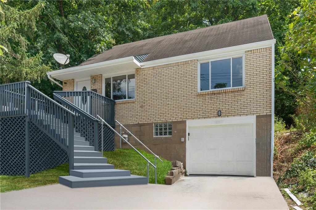 629 Beulah Road Pittsburgh, PA 15235 - Photo 1 of 26 a view of a house with wooden fence and two windows