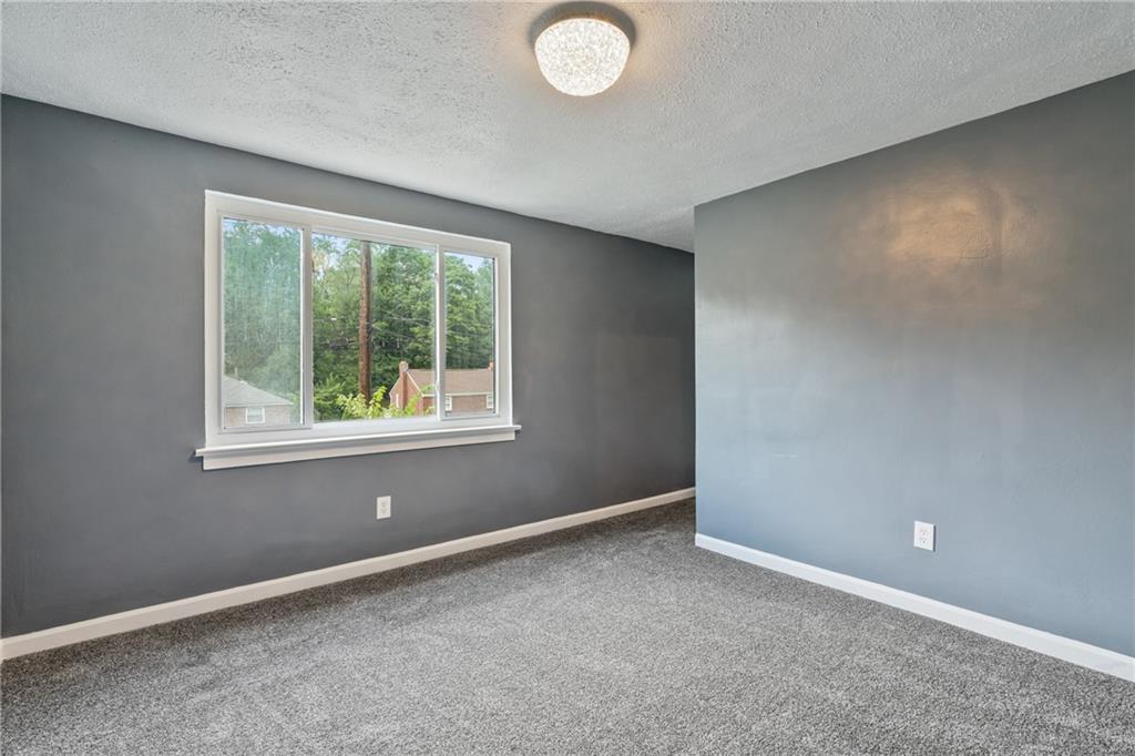 629 Beulah Road Pittsburgh, PA 15235 - Photo 14 of 26 an empty room with windows