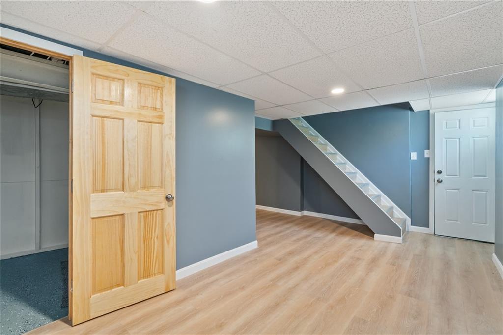 629 Beulah Road Pittsburgh, PA 15235 - Photo 20 of 26 wooden floor in an empty room with a window