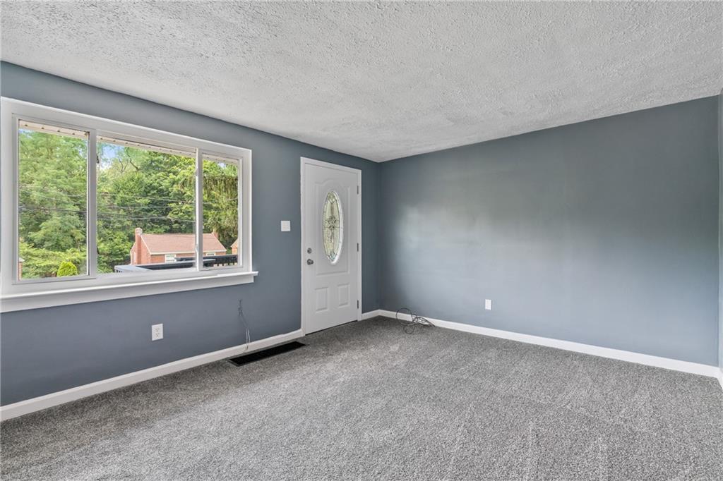 629 Beulah Road Pittsburgh, PA 15235 - Photo 2 of 26 a view of an empty room with a window