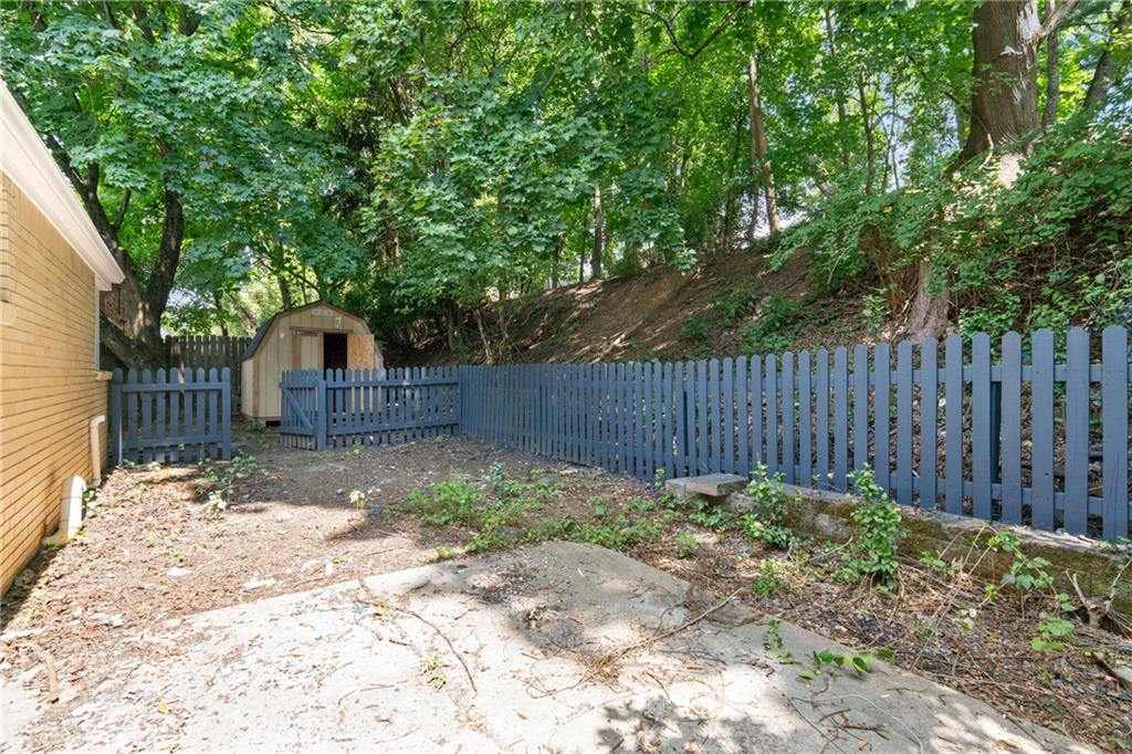 629 Beulah Road Pittsburgh, PA 15235 - Photo 25 of 26 a backyard of a house with green landscape